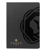 A black textured notebook or journal with a large embossed black geometric logo on the right side and a small gold Cross brand logo and text at the bottom left, shown on a plain white background.